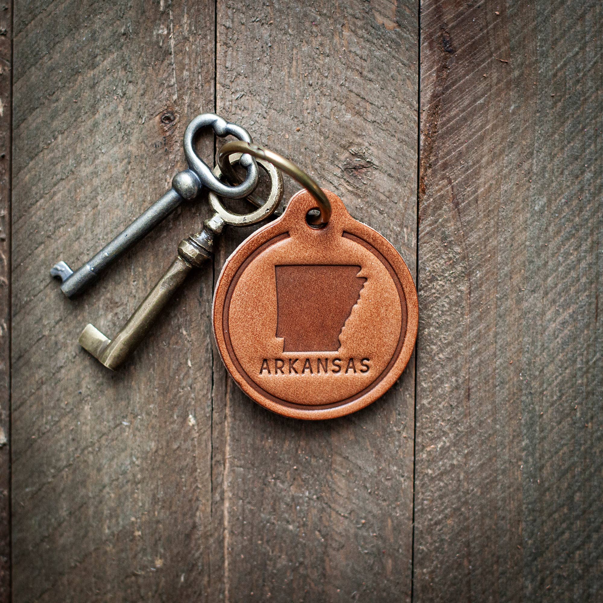 Arkansas State Silhouette Leather Keychain Circle