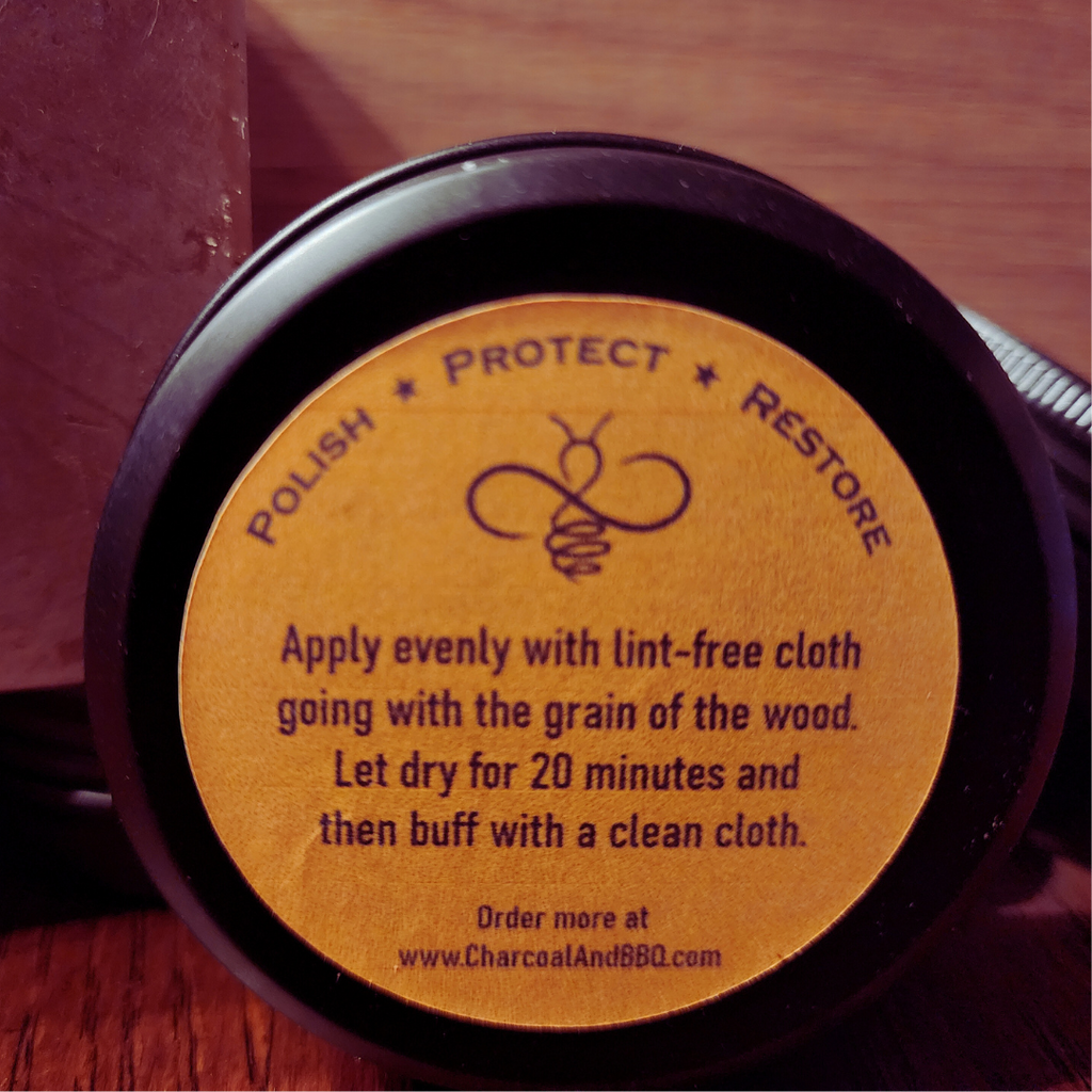 A Picture of a 3 OZ can of Wood wax from the front.  Named Hive and Oil. 