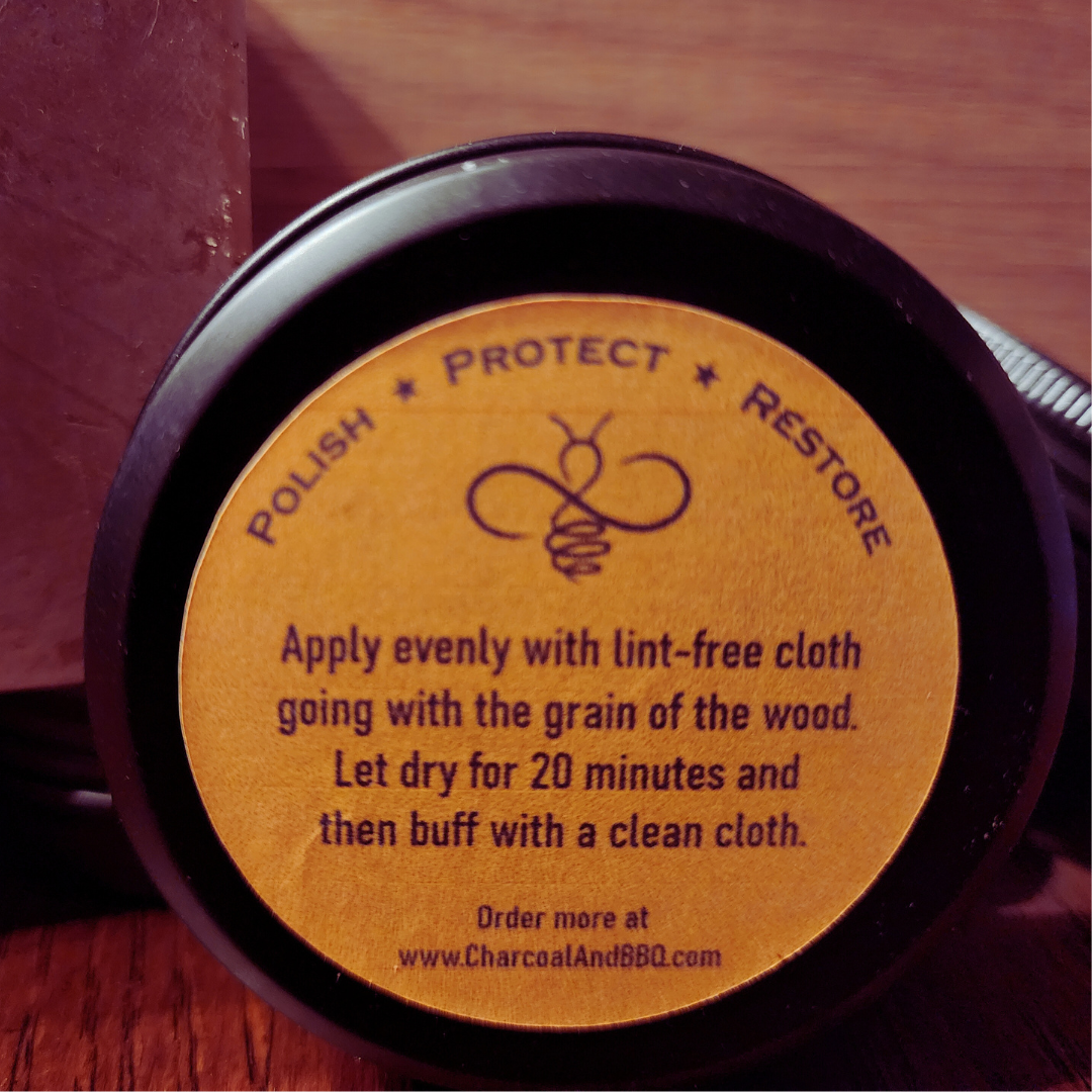 A Picture of a 3 OZ can of Wood wax from the front.  Named Hive and Oil. 