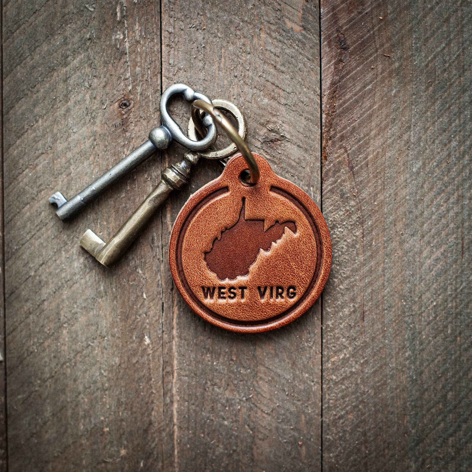 West Virginia State Silhouette Leather Keychain Circle